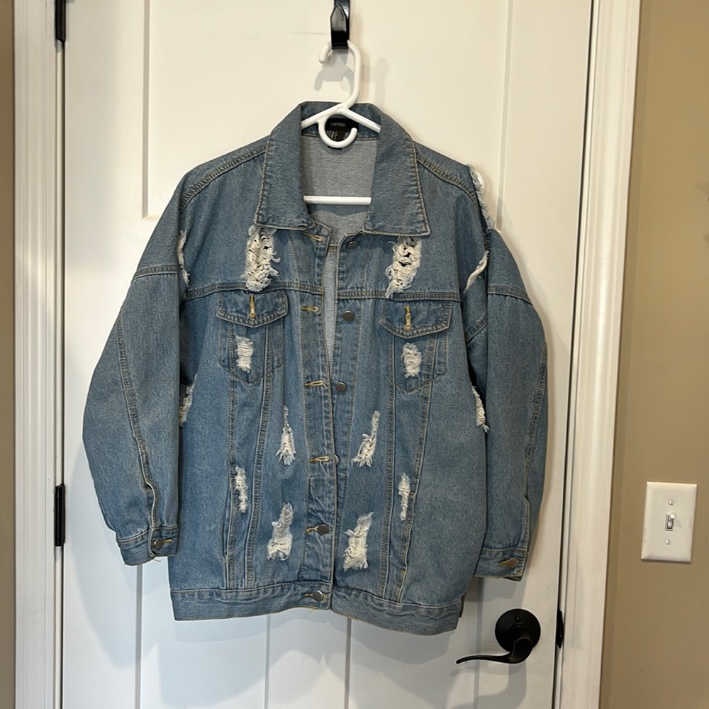 Ripped detail jean jacket worn only a few times. Great condition